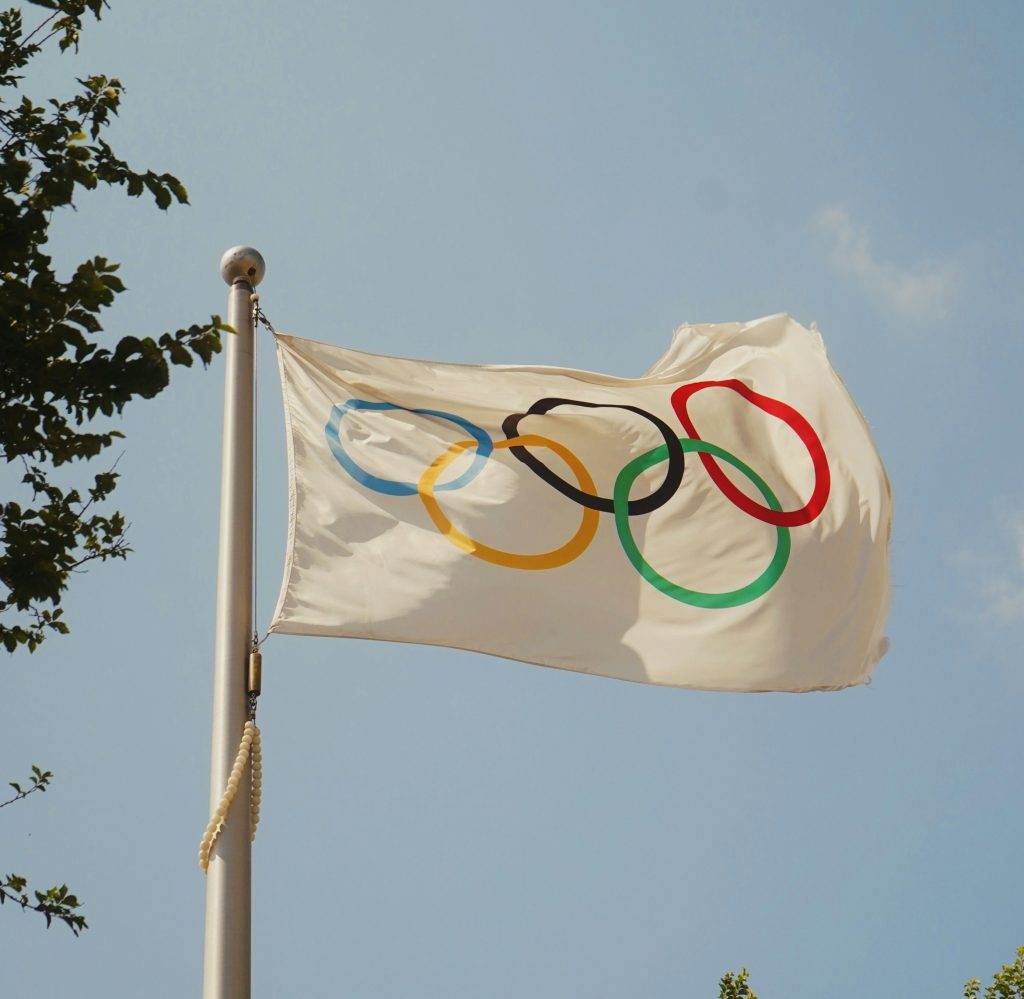 white flag with Olympic circles